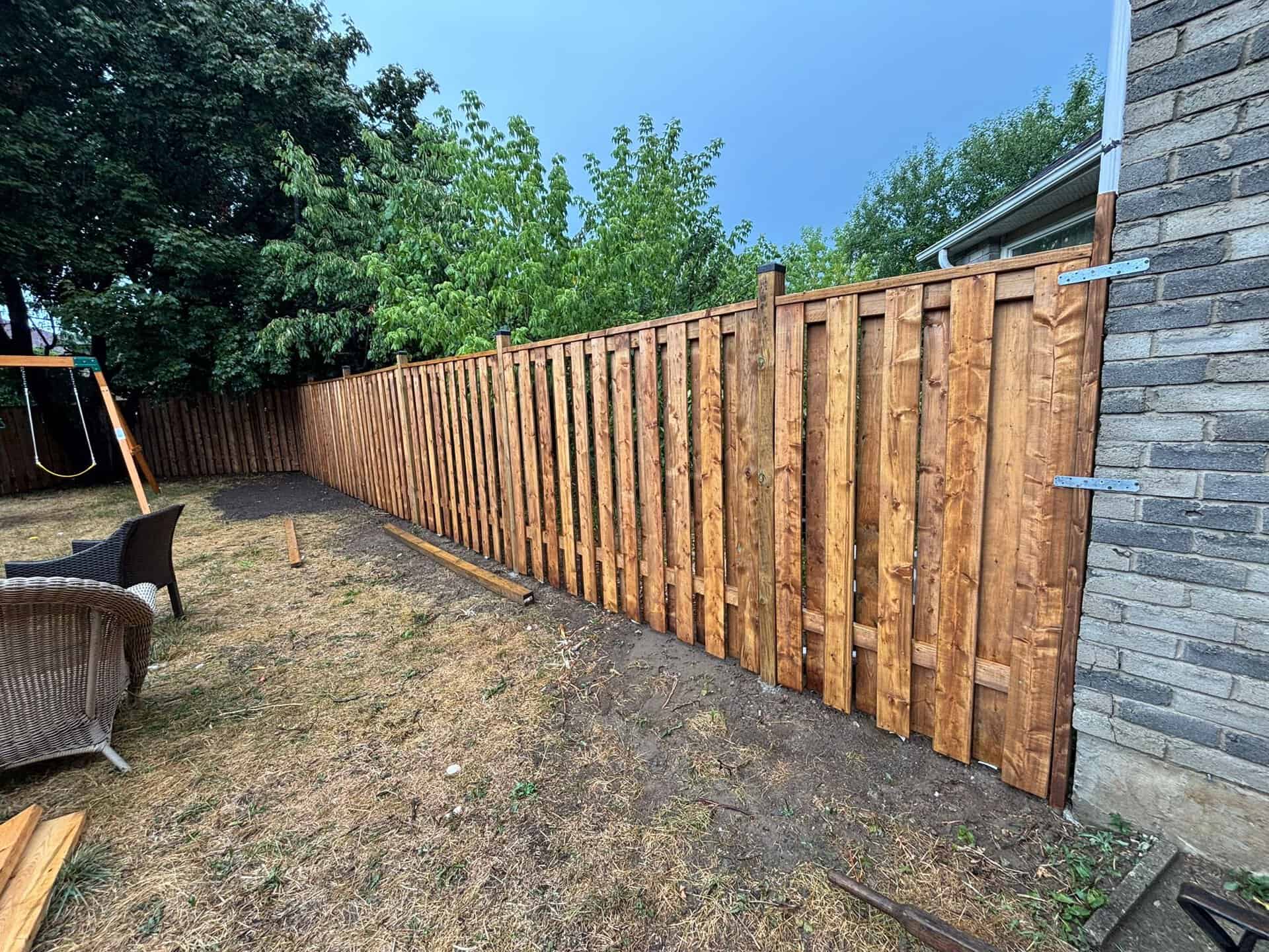 Wooden fence installation and maintenance considerations for homeowners.